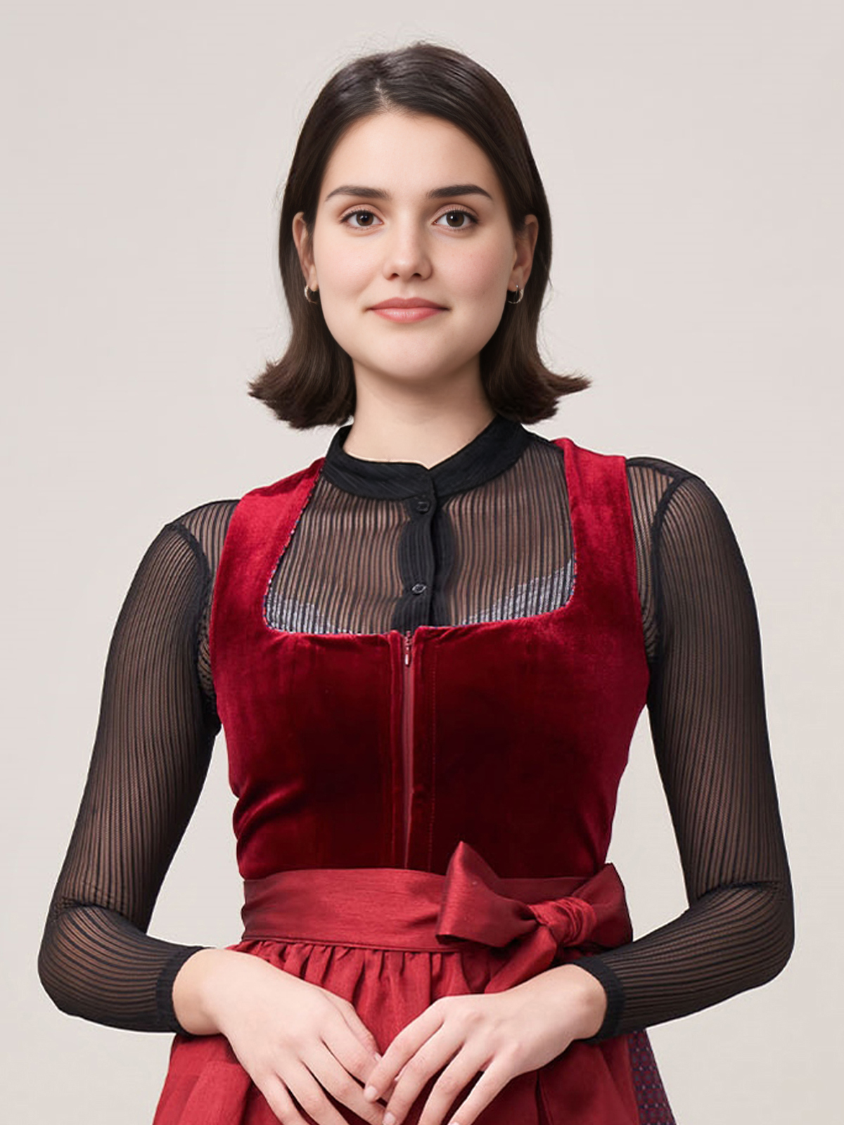 Beiges Dirndl mit roter Schürze